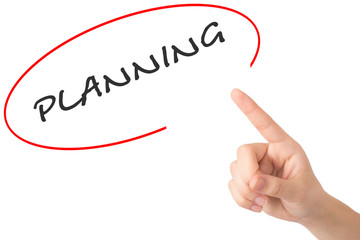 Hand of a young girl points to a word