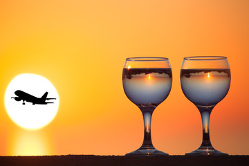Glass of white vine with reflections of houses and view to beaut