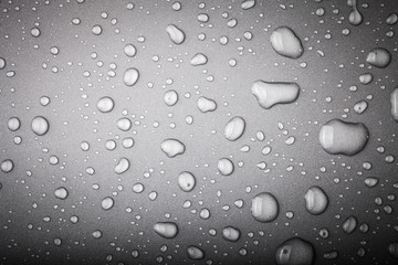 Drops of water on a color background. Gray. Toned