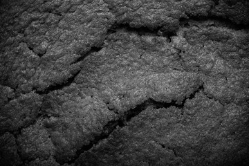 Top of fresh chocolate cake with cracks. Toned