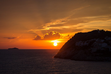 View of a beautiful sunset and orange sky in Dubrovnik, Croatia. Copy space.