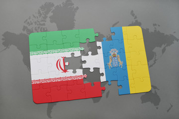 puzzle with the national flag of iran and canary islands on a world map background.