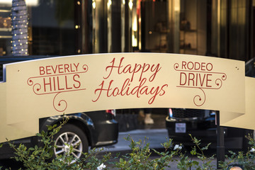 Fototapeta premium Beverly Hills Happy Holidays Sign on Rodeo Drive during Christmas Time in winter
