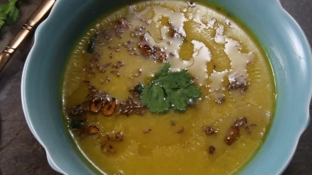 Zooming out and zooming in yellow lentils or Arhar daal, and Indian lentil soup.