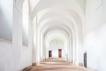 Fototapeta na wymiar Monastery interior hallway cloister white clean archway, Plasy, Czech republic