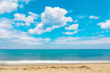 Fototapeta na wymiar Beach sand sea ocean blue water wave sun tropical island resort summer vacation