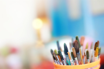 Group of old used paint brushes with clean background,soft focus.