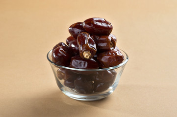 Dates in glass bowl. Dries dates fruit