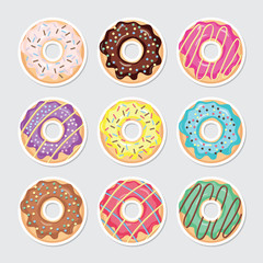 Glazed colored paper cutout donut set .