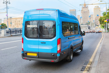 Fototapeta na wymiar minibus goes on the city