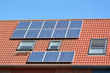 Fototapeta premium Solar energy panels on roof of house