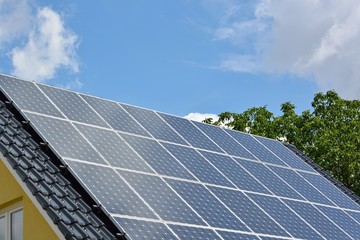 Fototapeta premium Solar energy panels on roof of house