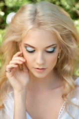Naklejka premium Beautiful young woman. Make up and hair stiling.