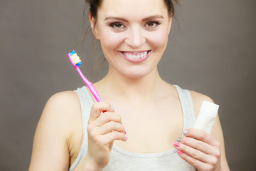 Woman brushing cleaning teeth