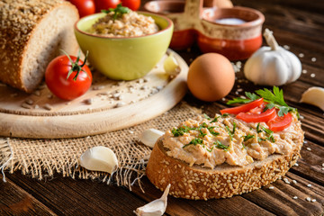 Spread with chicken meat, eggs, mustard, garlic and pepper