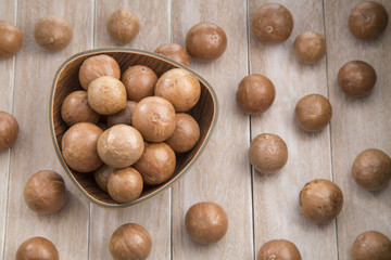 Macadamia nuts on a wooden table
