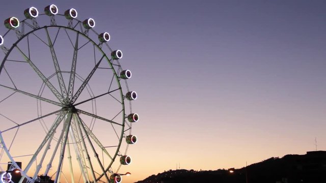 Ferris wheel in Bilbao at sunset.