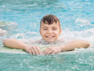 Fototapeta na wymiar Happy boy in pool