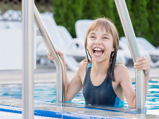 Happy girl in pool