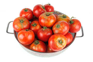 new picked fresh ripe tomatoes in container isolated on white background