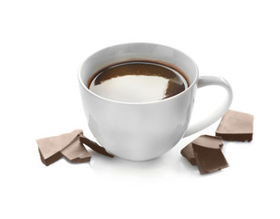 Cup of hot chocolate and pieces, isolated on white