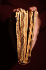 Woman hands holding old book