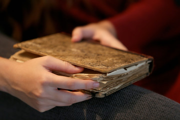 Woman holding old book