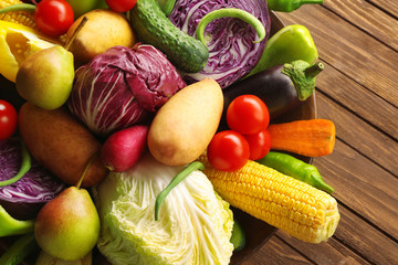 Vegetables in a bowl on a wooden background