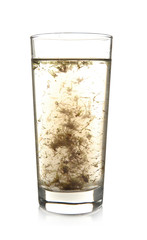 Glass of contaminated water isolated on white