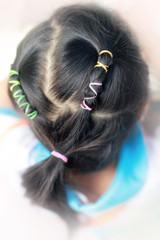 Fototapeta premium Little Asian girl with braided hairstyle.