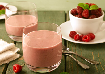 Healthy berry with raspberry, oatmeal and mint in a glass