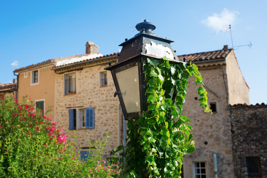 old street lamp in front of old buildings