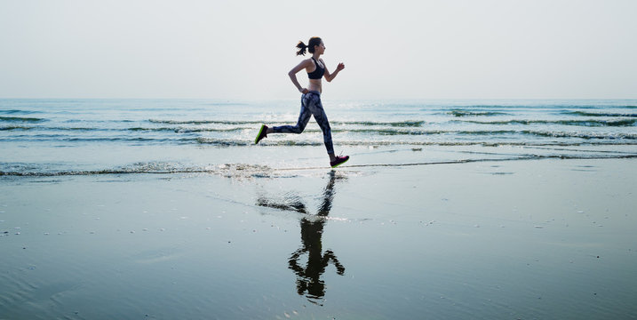 Woman Running Beach Morning Exercise Concept