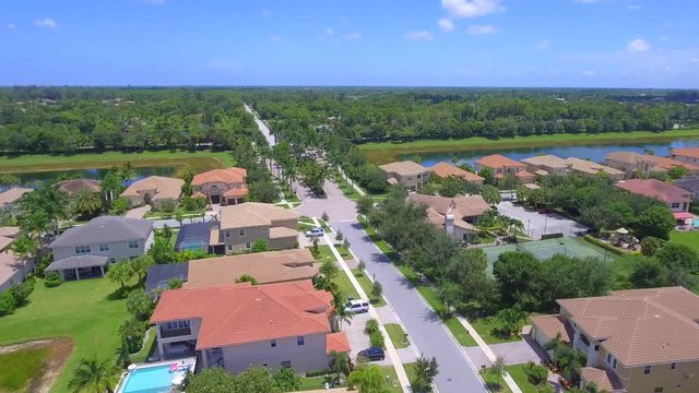Aerial video of luxury homes in a residential neighborhood in West Palm Beach FL