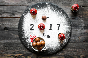 2017 Happy new year table with sugar and chocolate