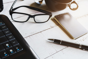 Fototapeta premium Laptop with Notepad and cup of coffee