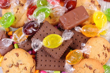 Heap of colorful candies and cookies, too many sweets