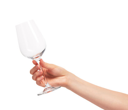 Female hand holding empty clean transparent wine glass