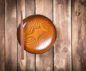 Chopsticks and Empty bowl on wooden,Top view