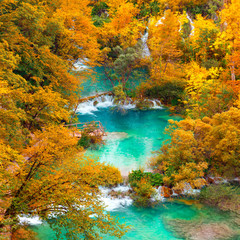 Naklejka na ściany i meble Autumn view on waterfalls and lakesl with turquoise water and g