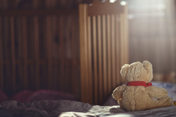 Teddy bear in an empty child's room - 118861712