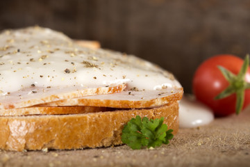 Open faced chicken ham sandwich with garilic sauce