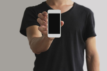 guy is showing a white phone with a black screen vertically