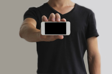 guy is showing a white phone with a black screen horizontally