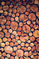 Pieces of wood on the concrete wall,color toned.