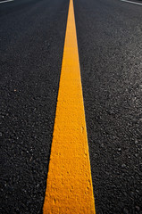 Asphalt road with separation yellow lines