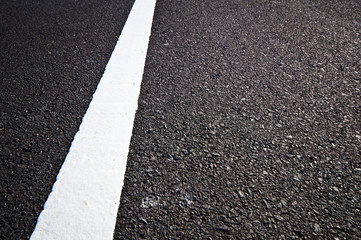 Asphalt road with separation white lines