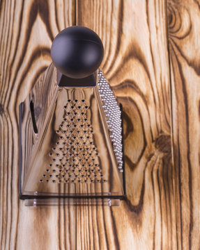 Pyramid grater on wooden table