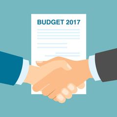Budget 2017 handshake. Businessmen shaking hands in agreement about budget in 2017. Business strategy in 2017.