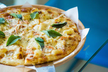 Hawaiian style pizza with pineapples